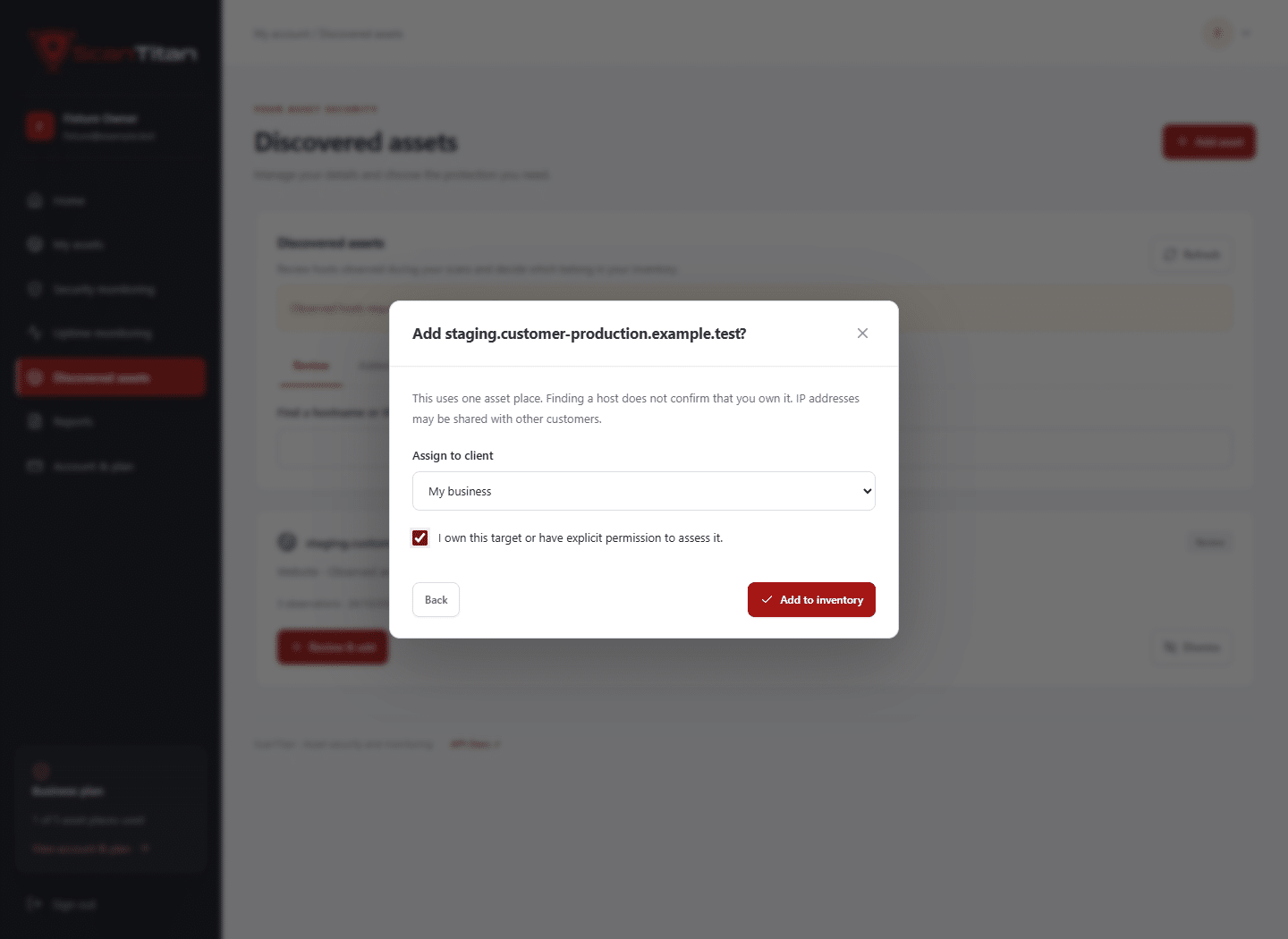 Discovered asset review screen where a candidate is confirmed as authorized and assigned to a client, shown with a reserved example.test domain
